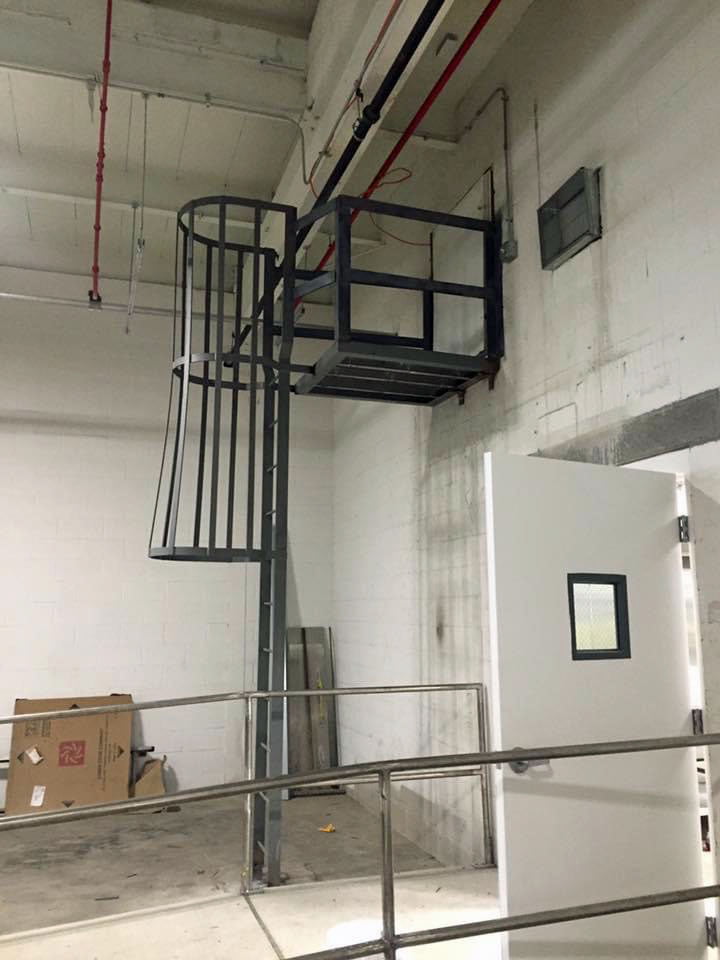 Indoor or outdoor accesses - fixed ladders with safety cages.